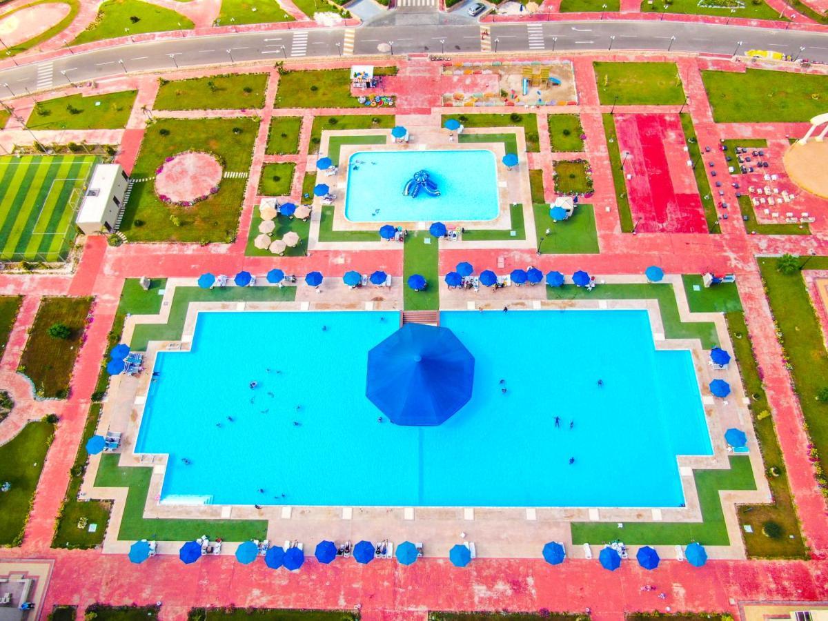 Tolip North Coast Hotel El Alamein Exterior foto Aerial view of the pool
